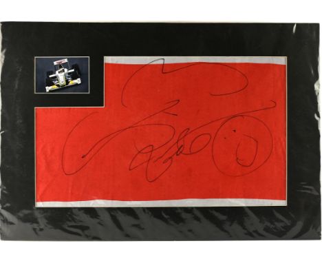 Jenson Button Autograph Display, With photograph top left and large signature on a partial union jack flag, mounted on board 