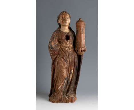Spanish school, first half of the 17th century."Saint Barbara".Carved and polychrome wood.Sculpture-reliquary.Faults in the w