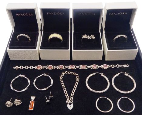 Silver and silver stone set jewellery including four boxed Pandora rings, three pairs of hoop earrings and an amber pendant, 