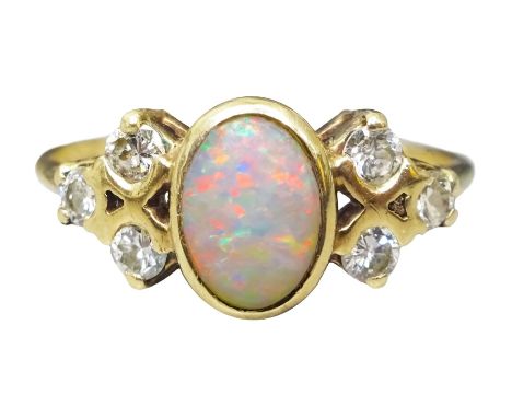 9ct gold opal and six stone round brilliant cut diamond ring, hallmarkedCondition Report:Approx 2.15gm, size L, bright well m