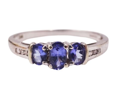 9ct gold three stone oval tanzanite ring, with channel set diamond shoulders, stamped 375Condition Report:Approx 2.05gm, size