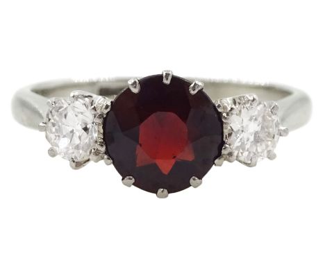 18ct white gold three stone round ruby and diamond ring, ruby approx 1.00 carat, total diamond weight approx 0.40 caratCondit