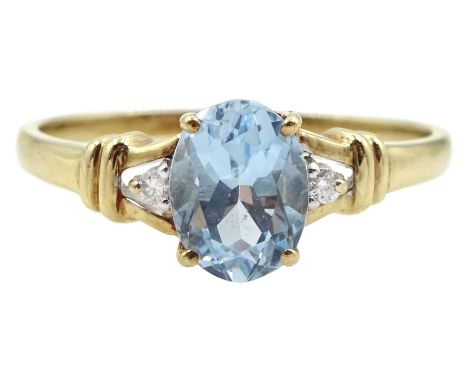 9ct gold three stone oval blue topaz and diamond ringCondition Report:Approx 2.45gm, sizeT