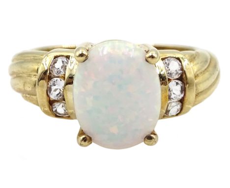 9ct gold single stone opal ring with white topaz shoulders,    hallmarked Condition Report:Approx 4.6gm, size M, well present