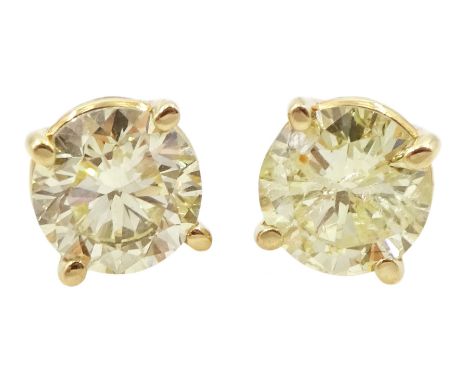 Pair of gold round brilliant cut diamond stud earrings, stamped 14K, total diamond weight approx 1.05 caratCondition Report:G