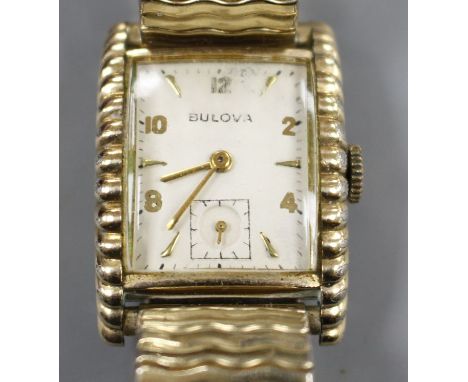 A gentleman's 1950's '10k gold filled' Bulova Westover 'clam shell' cased manual wind wrist watch, with Arabic and baton nume