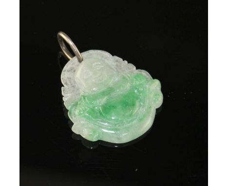 A jade pendant carved with a buddha, with white metal bale, pendant 37mm, gross weight 9.7 grams. Condition: There are numero
