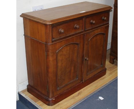 A Victorian mahogany side cabinet, W.100cm D.40cm H.89cm Condition: Slightly faded to the top, moulding on the left corner is