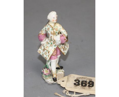 A Chelsea red anchor toy figure of a gallant gentleman, c.1755, 6.5cm Condition: Discoloured restoration around his neck, pon