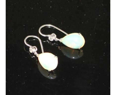 A pair of white metal, pear shaped white opal and diamond set drop earrings, opals approx. 12mm, gross weight 2.7 grams. Cond