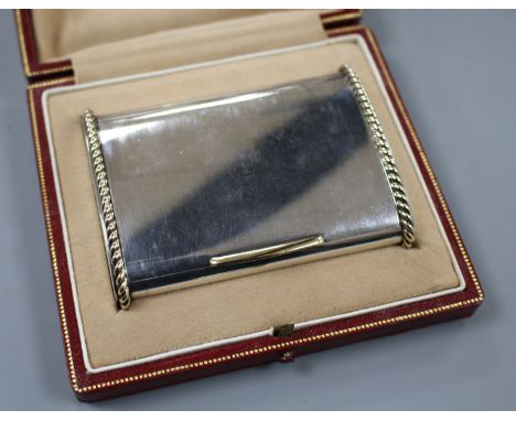 A George VI Cartier silver and yellow metal mounted cigarette case, in original fitted Cartier gilt tooled leather box, Londo