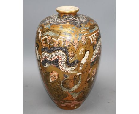 A Japanese Satsuma vase, decorated with a dragon and immortals, signed to the base, height 36cm Condition: Some light wear to