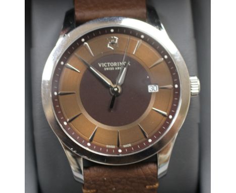 A gentleman's modern stainless steel Victorinox Swiss Army quartz wrist watch, with baton numerals and date aperture, on orig