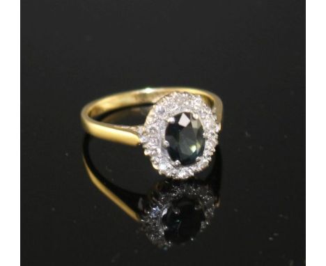 An 18ct and Plat, sapphire and illusion set diamond oval cluster ring, size M, gross weight 3.5 grams, sapphire approximately