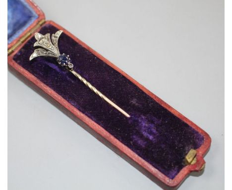 An early 20th century yellow and white metal, sapphire and diamond set stick pin, 62mm, gross weight 2.4 grams. Condition: On