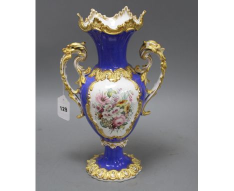 A Victorian porcelain vase, painted with panels of garden flowers, height 35cm Condition: Minor firing flaws inside the neck 