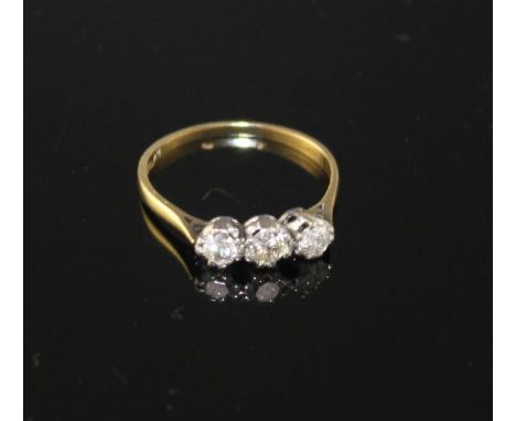 An 18ct and Plat, three stone diamond ring, size P, gross weight 1.8 grams, total diamond weight approximately estimated as 0