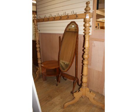 A large turned pine coat rack, W.180cm H.190cm Condition: Looks to be in good clean condition, five of the hooks screwed half