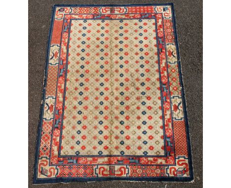 A small Chinese Suiyvan carpet, the fawn ground field woven with a lattice pattern, each cross centred by flowerheads, within