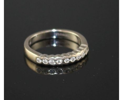 A modern 18ct white gold and ten stone diamond chip set half eternity ring, size M, gross weight 4.5 grams. Condition: Top se