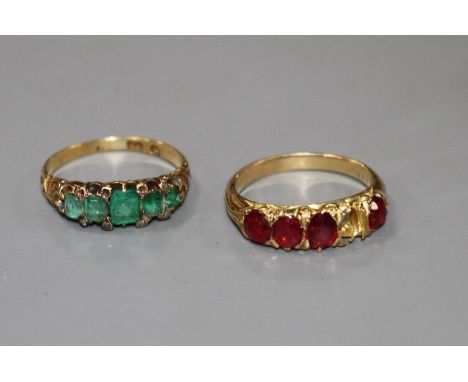 A George V yellow metal, graduated five stone emerald and diamond chip ring and one other four(ex five) stone ring. Condition