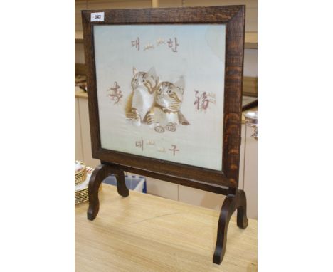 An early 20th century Japanese silkwork panel of two kittens, mounted as an oak firescreen, panel 40 x 43cm and J. Baudet, se