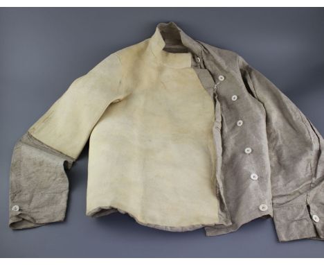 A late 19th century linen fencing jacket, with suede leather protect for body and arm for right handed fencer Condition: Sued