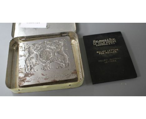 A cut steel seal matrix with the Royal Coat of Arms and engraved by appointment to HM The Queen, 6.5 x 7cm, with makers plaqu