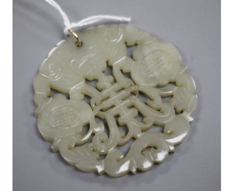 A Chinese pierced and carved pale celadon jade circular plaque pendant, 59mm, gross weight 23.5 grams. Condition: A few very 