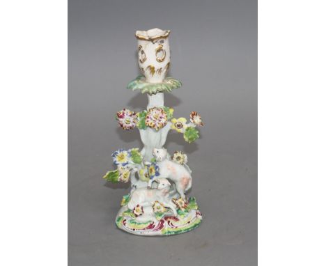 An early Derby figural 'sheep and tree' candlestick, c.1758, 21.5cm Condition: With losses to the flowers and leaves, and res