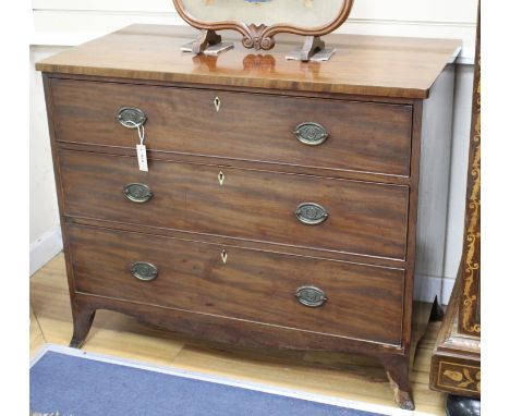 A Regency mahogany chest of three long drawers, W.108cm D.56cm H.89cm Condition: Overall of fairly flat mid brown tone but th