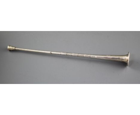 A George V silver hunting horn by E. Baker &amp; Sons, Birmingham, 1917, 30.4cm, 41 grams. Condition: Funnel end has a dented