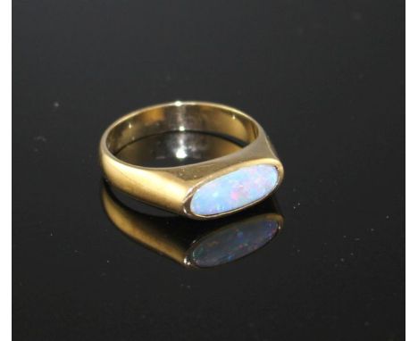 A modern 9ct gold and collet set white opal set dress ring, size M, gross weight 3.9 grams. Condition: A few very minute surf