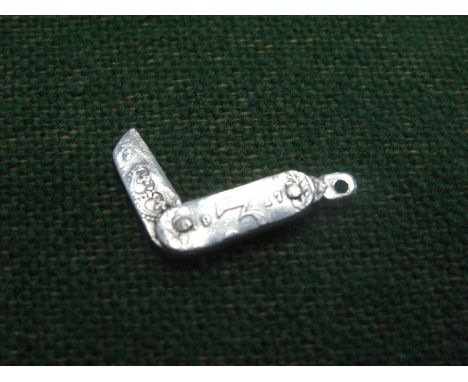 Miniature Pocket Knife, embossed 1914 - 1917 scales, ornate blade 1.5cm closed.
