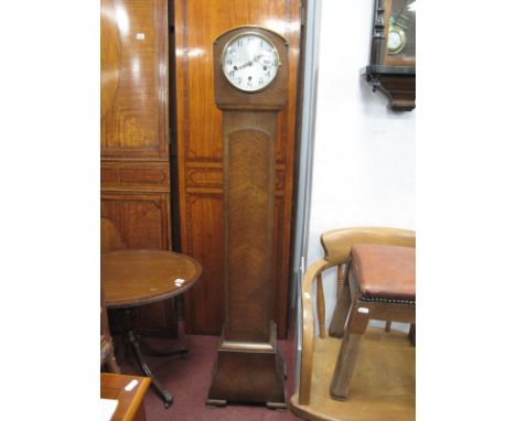 A 1930's Oak 'Enfield' Grandmother Clock, silver dial shaped base, on bracket feet, 144cm.