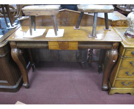 A XIX Century Oak Console Table, a low back with applied shield, top with moulded edge, central drawer on shaped forefront le