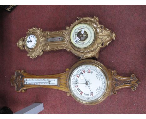 Early XX Century Oak Aneroid Barometer, with a white enamel dial; together with one other clock barometer. (2) 
