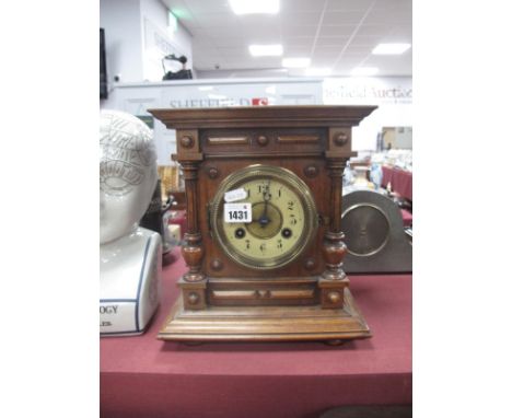Late XIX Century Walnut Mantel Clock, with a circular dial, split balusters, stepped base, bun feet, 25cm wide.