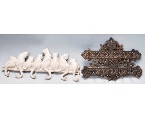 Two vintage style cast iron key racks comprising of a classic Victorian style backplate with 11 hooks together with another k