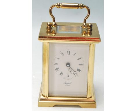 A vintage mid to late 20th Century Rapport London brass cased carriage clock having bevelled glass panels to the dies and exp