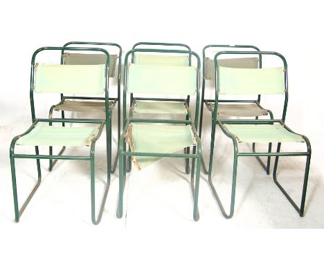 A set of six retro vintage mid 20th century Industrial tubular metal stacking chairs ( dining )&nbsp; having green canvas sea