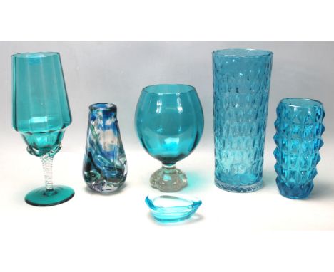 A collection of vintage 20th century teal blue studio art glass. To include a large control bubble brandy glass, large spiral