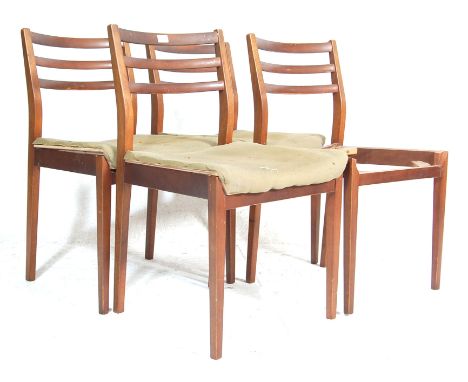 A set of 4 retro mid 20th century vintage teak wood G Plan Ernest Gomme&nbsp;dining chairs with upholstered seats raised on t
