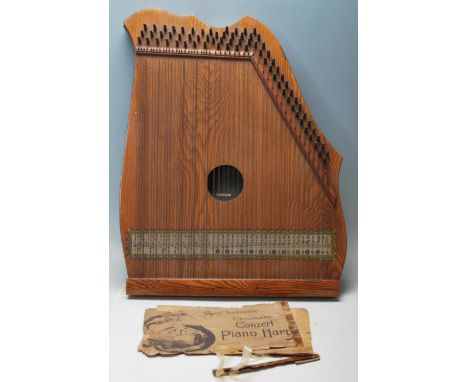 A vintage mid century Abbley’s chromatic concert piano harp with wooden body and self instructions.&nbsp;