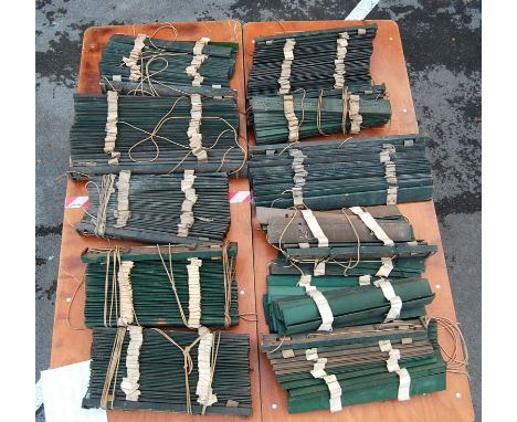 A set of 20 vintage late 20th century wooden venetian shutter blinds having a dark green colourway. The blinds are fully adju