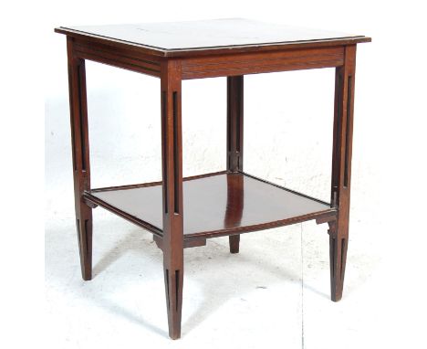 A late Victorian 19th century mahogany occasional side table. The table having a rectangular top over shaped supports united 