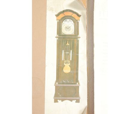 A late 20th century contemporary grandfather clock by Bentima. The antique style clock having a mahogany case with brass face