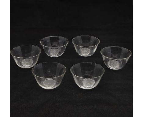A set of six small Lalique glass bowls in the 'Barr' design, the clear glass bowls with a small frosted section showing a fem