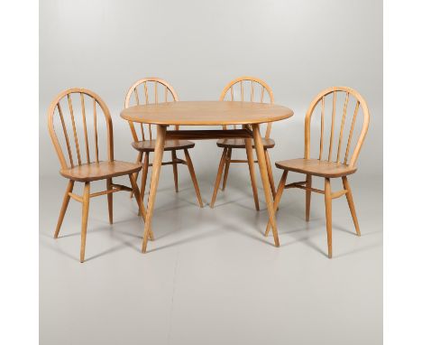 A light elm and beech circular breakfast table with spindled shelf underneath, supported on splayed legs ( Model No 396), sta