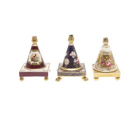 A Chamberlain Worcester lidded candle snuffer, painted with a peacock within a shaped gilded border, with a dark red ground a